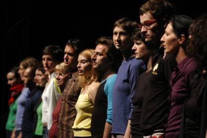 A line of people seen from the side