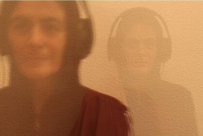 A woman wearing headphones