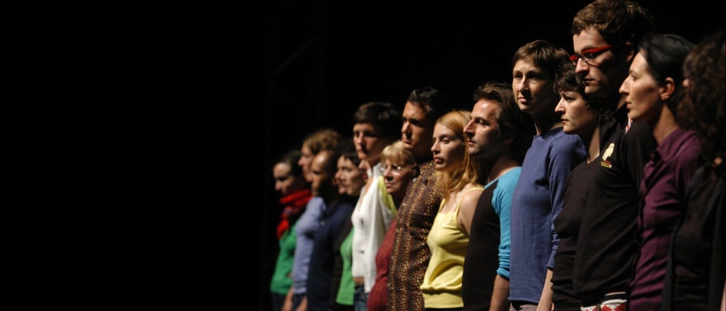 A line of people seen from the side