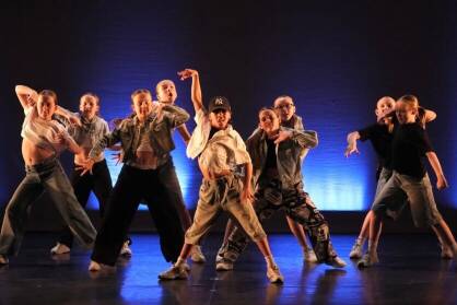 A group of young performers on stage doing Hip-Hop